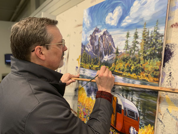 JoeHeins_Painting2 Artist Joe Heins working on his first painting in the series - The Mountain West